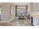 Spacious dining room featuring neutral walls, a modern chandelier, and plenty of natural light at 4719 Cabreo Ct, Bradenton, FL 34211