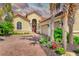 Charming home with a brick driveway, well-manicured lawn, lush tropical plants and a two-car garage at 4719 Cabreo Ct, Bradenton, FL 34211