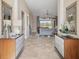 Spacious foyer with stone floors leading to an open living area with bright natural light and a beautiful view at 4719 Cabreo Ct, Bradenton, FL 34211