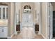 Elegant foyer with high ceilings, decorative lighting, and double doors at 4719 Cabreo Ct, Bradenton, FL 34211