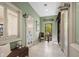 Welcoming hallway leads to spa and salon with doors, decorative signs, and serene interior design at 4719 Cabreo Ct, Bradenton, FL 34211