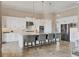 Modern kitchen featuring white cabinetry, stainless steel appliances, and a large island with seating at 4719 Cabreo Ct, Bradenton, FL 34211