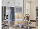 Kitchen featuring granite counters, stainless steel appliances, and a faucet detail at 4719 Cabreo Ct, Bradenton, FL 34211