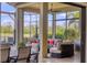 Enclosed patio space offering scenic views, outdoor seating, and a ceiling fan for added comfort at 4719 Cabreo Ct, Bradenton, FL 34211