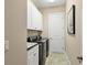 Convenient laundry room equipped with a front-load washer and dryer and ample cabinet space at 4719 Cabreo Ct, Bradenton, FL 34211