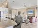 Open-concept living room with tile floors, neutral decor, and great natural light at 4719 Cabreo Ct, Bradenton, FL 34211