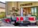 Outdoor kitchen featuring a grill, sink, and lounge area, as well as a view into the home at 4719 Cabreo Ct, Bradenton, FL 34211
