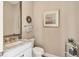 Well decorated half bath featuring granite countertops, modern fixtures, and stylish decor at 4719 Cabreo Ct, Bradenton, FL 34211