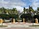 View of the Central Park entrance, a verdant landscaped gathering place with seating at 4907 Torrey Pines Run, Bradenton, FL 34211