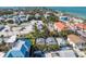 Aerial view of home with the beach in the background and lush landscaping around the property at 520 Spring Ave # A, Anna Maria, FL 34216