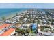 Aerial view of the property with the beach and neighboring homes surrounding the area at 520 Spring Ave # A, Anna Maria, FL 34216