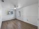 Spacious bedroom with updated flooring, two windows for natural light and painted in white at 520 Spring Ave # A, Anna Maria, FL 34216