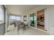 A screened-in balcony featuring an outdoor dining area, perfect for enjoying views and fresh air in a comfortable setting at 5628 Summit Point Cir # 103, Bradenton, FL 34210
