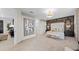 Spacious main bedroom with a decorative wall behind the headboard, neutral color scheme, and plenty of natural light at 5628 Summit Point Cir # 103, Bradenton, FL 34210
