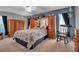 Spacious bedroom features a large built-in headboard, matching dressers, and soft natural light at 6608 13Th Avenue W Dr, Bradenton, FL 34209