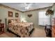 Cozy bedroom with tropical themed decor and a queen-sized bed at 6608 13Th Avenue W Dr, Bradenton, FL 34209
