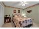 Serene bedroom with palm tree accents and a comfortable queen bed at 6608 13Th Avenue W Dr, Bradenton, FL 34209