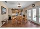 Dining room with wood flooring, display cabinet, and natural light at 6608 13Th Avenue W Dr, Bradenton, FL 34209