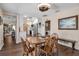 Bright dining room showcasing wood floors and access to the kitchen and laundry room at 6608 13Th Avenue W Dr, Bradenton, FL 34209