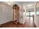 Inviting foyer with hardwood floors, a decorative display cabinet, and neutral paint at 6608 13Th Avenue W Dr, Bradenton, FL 34209