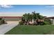 Charming home with a well-manicured lawn, mature landscaping, and an attached two-car garage at 6608 13Th Avenue W Dr, Bradenton, FL 34209