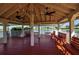Interior view of the lakeside gazebo with ceiling fans, benches, and panoramic views at 6608 13Th Avenue W Dr, Bradenton, FL 34209