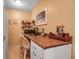 Bright home office space with a built-in desk, white cabinets, and convenient storage shelves at 6608 13Th Avenue W Dr, Bradenton, FL 34209