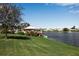 Picturesque lake view with a gazebo, lush greenery, and peaceful waterfront scenery at 6608 13Th Avenue W Dr, Bradenton, FL 34209