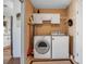 Practical laundry room with storage cabinets and modern appliances at 6608 13Th Avenue W Dr, Bradenton, FL 34209
