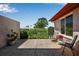 Relaxing outdoor patio area with seating and privacy hedges at 6608 13Th Avenue W Dr, Bradenton, FL 34209