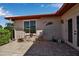 Cozy outdoor patio features two chairs, a small table, and decorative touches for relaxing in the fresh air at 6608 13Th Avenue W Dr, Bradenton, FL 34209
