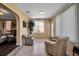Light-filled sunroom with tile flooring, comfortable seating, and access to the outdoors at 6608 13Th Avenue W Dr, Bradenton, FL 34209