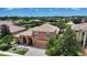 Stunning aerial view of a home with lush landscaping and beautiful community lake at 6961 Scrub Jay Dr, Sarasota, FL 34241