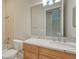 Well-lit bathroom showcasing a granite countertop, wooden vanity, and a shower-tub combination at 6961 Scrub Jay Dr, Sarasota, FL 34241