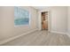Bedroom with wood style flooring and closet at 6961 Scrub Jay Dr, Sarasota, FL 34241