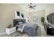 Cozy bedroom with neutral tones, a plush bed, and a window offering natural light at 6961 Scrub Jay Dr, Sarasota, FL 34241