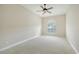 Serene, spacious bedroom with a large window and neutral carpet, bathed in soft, natural light at 6961 Scrub Jay Dr, Sarasota, FL 34241