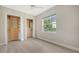Bedroom featuring built-in closet organizers and neutral walls at 6961 Scrub Jay Dr, Sarasota, FL 34241