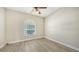 Bright bedroom with a large window and neutral color palette at 6961 Scrub Jay Dr, Sarasota, FL 34241