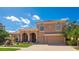 Stunning two-story home with paver driveway, manicured landscaping, and a tile roof at 6961 Scrub Jay Dr, Sarasota, FL 34241