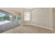 Inviting living room with wood floors and sliding glass doors to the screened patio and pool area at 6961 Scrub Jay Dr, Sarasota, FL 34241