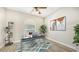 Well-lit office space with a modern desk, decorative rug and ample natural light at 6961 Scrub Jay Dr, Sarasota, FL 34241