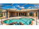 Beautiful screened in pool and patio area with a luxurious spa, perfect for relaxing and entertaining outdoors at 6961 Scrub Jay Dr, Sarasota, FL 34241