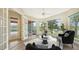 Bright sitting area with pool and lake views at 6961 Scrub Jay Dr, Sarasota, FL 34241
