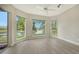 Relaxing sitting area with scenic lake views from large windows at 6961 Scrub Jay Dr, Sarasota, FL 34241