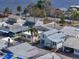 Aerial view of homes near a body of water with a pier at 7 High St, Bradenton, FL 34208