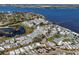 Aerial view of waterfront community with pond, pier, and easy access to water activities at 7 High St, Bradenton, FL 34208