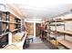 Unfinished basement area with storage shelves and potential for workshop at 7 High St, Bradenton, FL 34208