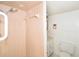 Bright tiled shower with standard head and view to adjacent toilet and sink at 7 High St, Bradenton, FL 34208