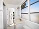 Bathroom with a single vanity, window, and access to the backyard at 7 High St, Bradenton, FL 34208